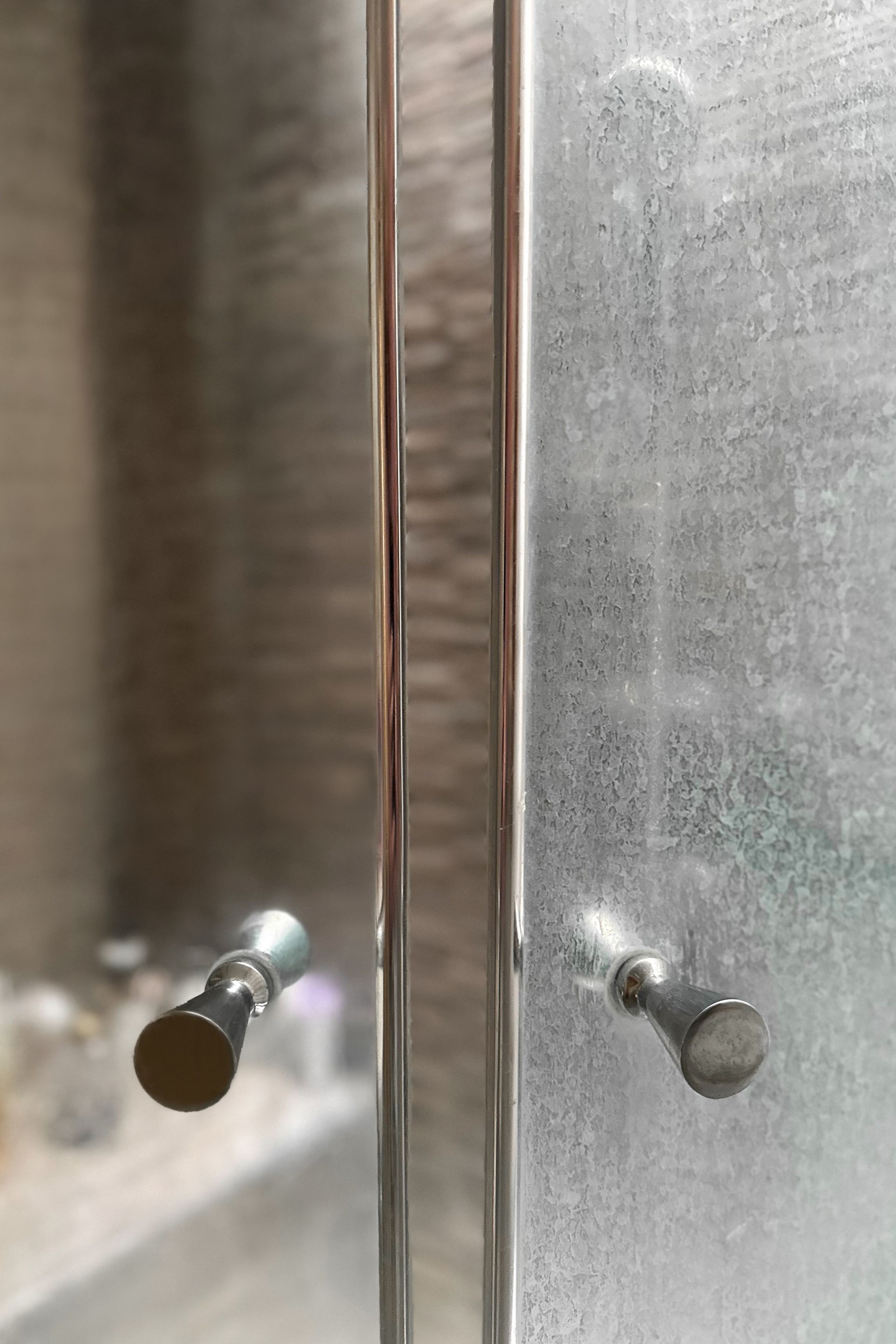 dirty shower glass door with white mineral residue from hard water and soap scum. Another side after cleaning